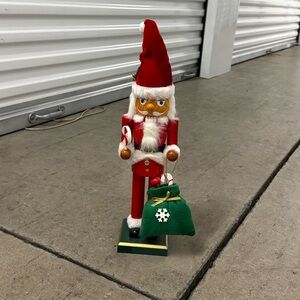 Festive Nutcracker with Santa Hat and Green Bag